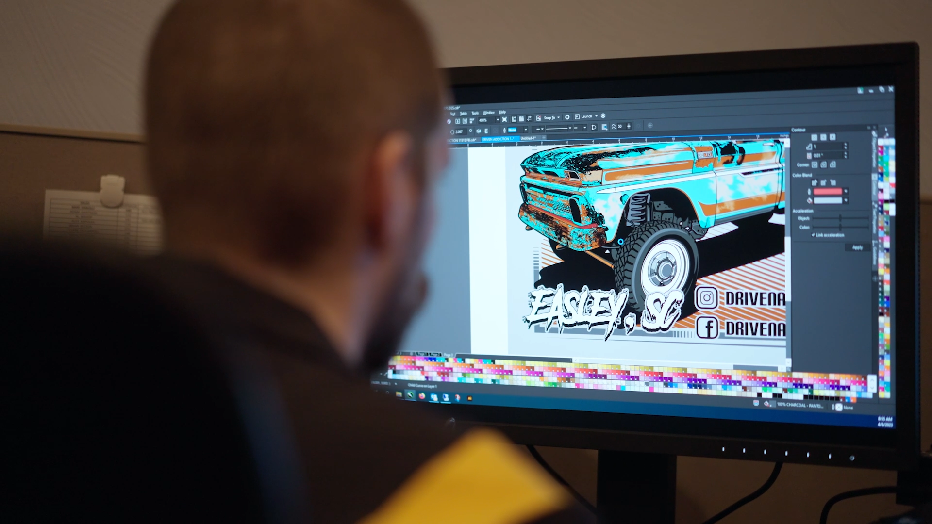 Excel Sportswear in-house artist refining a custom truck illustration in vector software